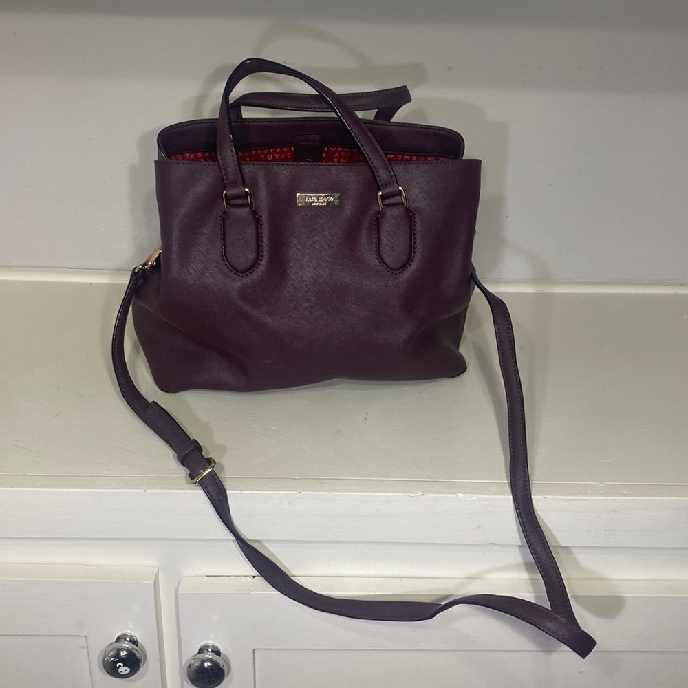 Large wine colored kate spade tote with cross body strap